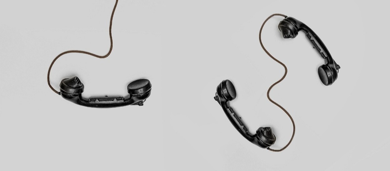 Phone left hanging. Photo by Alex Andrews Pexels - old school phones laying unattended